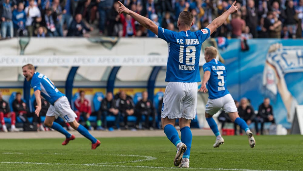 The scorer takes off: Behrens (left) celebrates his dream goal to take the lead.